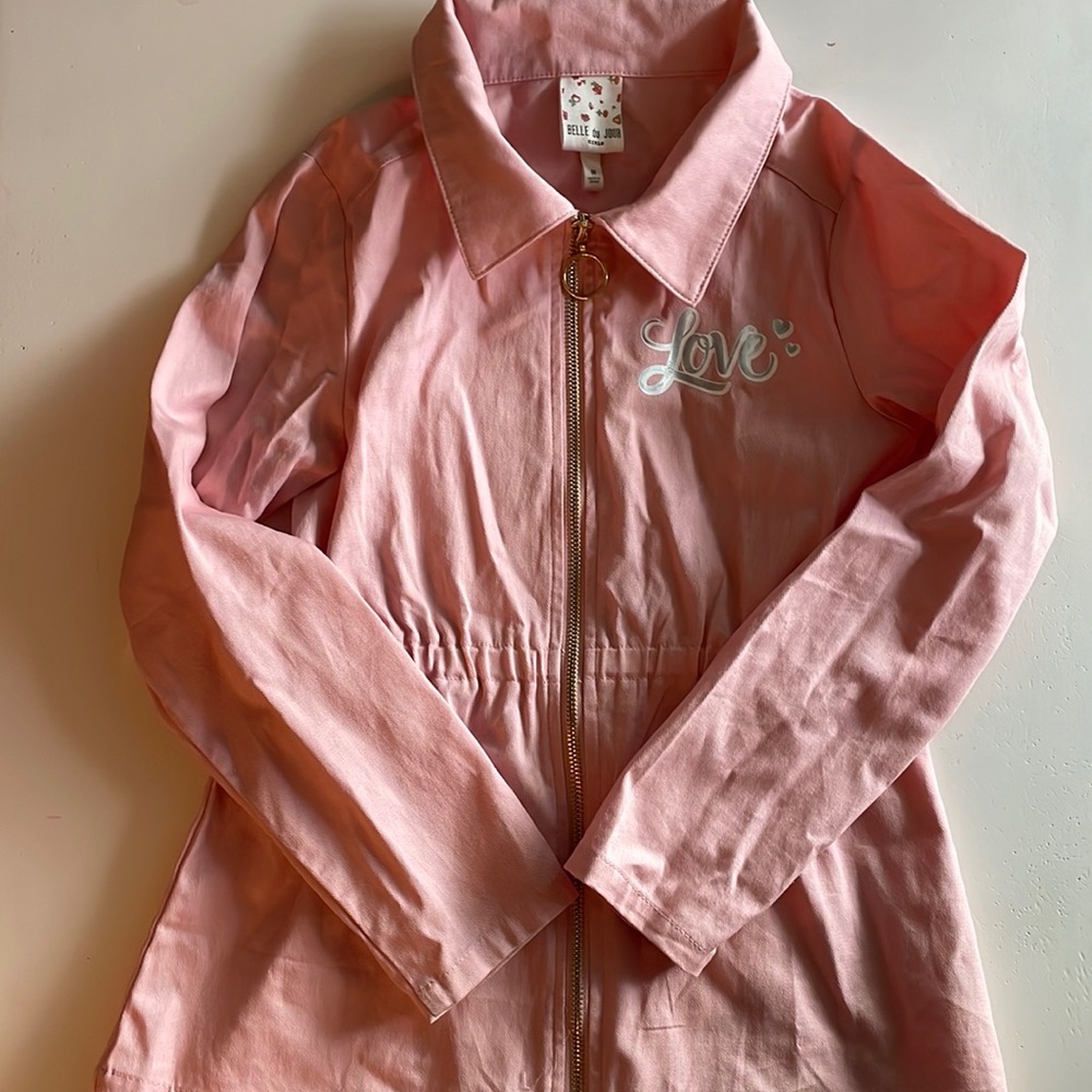 Zip up lightweight jacket with flip sequin heart.
